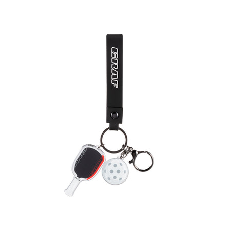 Graf keychain with paddle and white ball charm on a white background