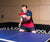Image of Joerg Rosskopf playing table tennis on a JOOLA table.