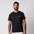 Image of a male model wearing a JOOLA men's court short sleeve shirt, black.