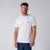 White background, image of a male model wearing a JOOLA Men's Court Short Sleeve Shirt, white.