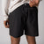 Close up image of the back of a pair of JOOLA Men's Woven Shorts, 5-inch inseam, black.