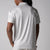 Gray background, image showing the back of a male model wearing the JOOLA Men's Club Printed Polo, Safari Leopard print.