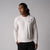 Gray Background, image of a male model wearing the JOOLA men's court long-sleeve shirt, sandstone.