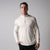 Gray background, male model wearing a JOOLA Men's Quarter Zip Pullover, sandstone color.