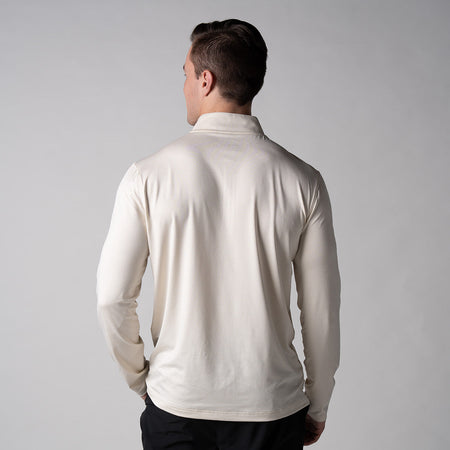 Gray background, image showing the back of a male model wearing a JOOLA Men's Quarter Zip Pullover, sandstone color.