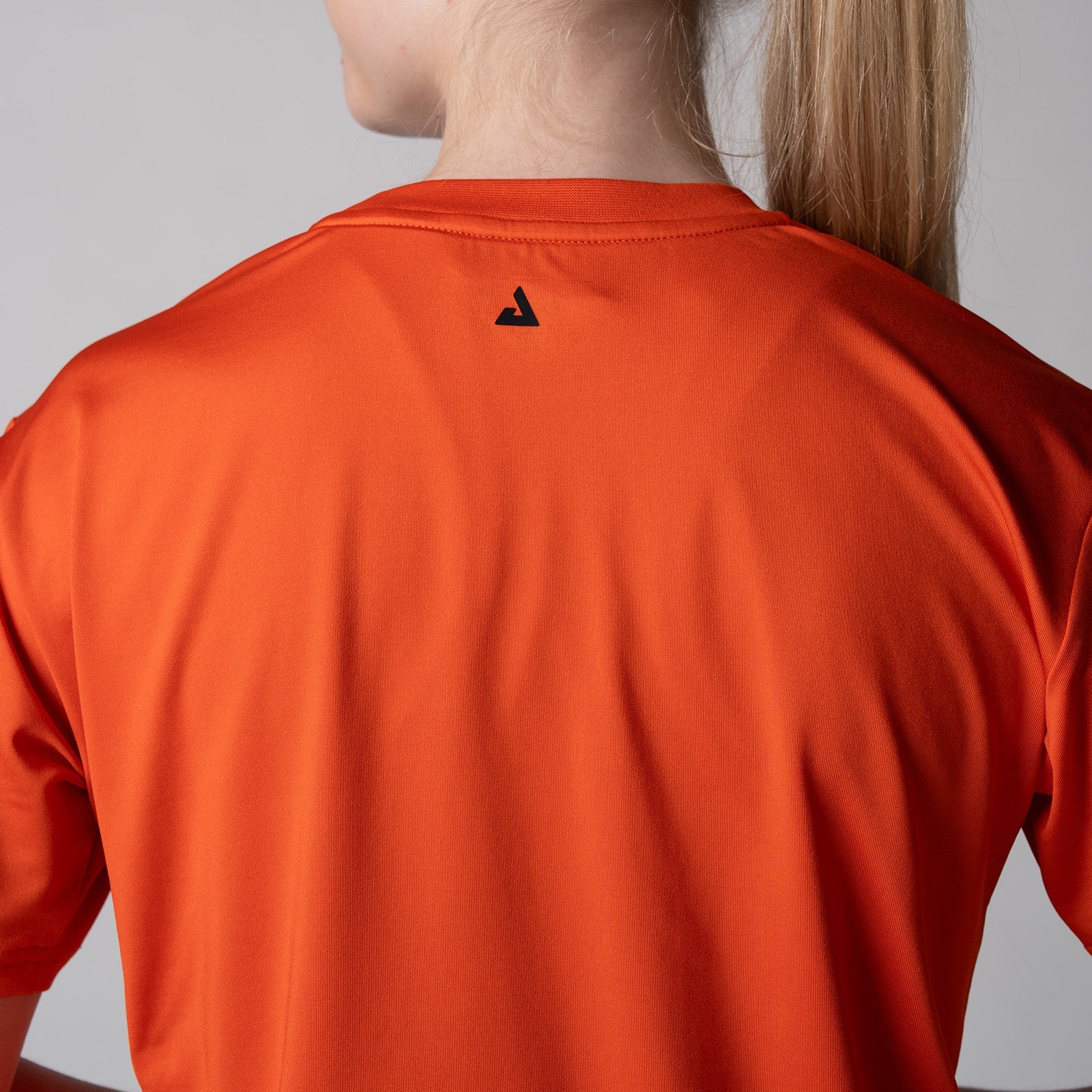 Image of a female model wearing a JOOLA Women's Court Crop Tee, White.