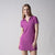 Gray background, image of a female model wearing a JOOLA women's novelty polo dress, passion purple.