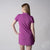 Gray background, image of a female model wearing a JOOLA Women's Novelty Polo Dress, Passion Purple.