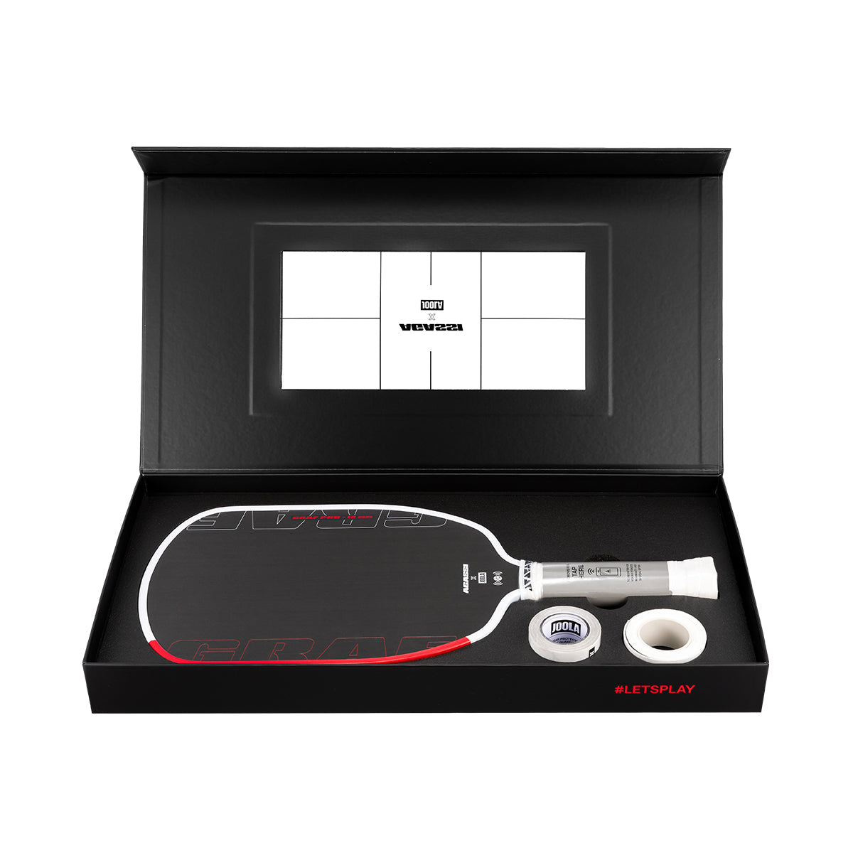 Pickleball paddle and ball set in a black box with a visible brand logo.