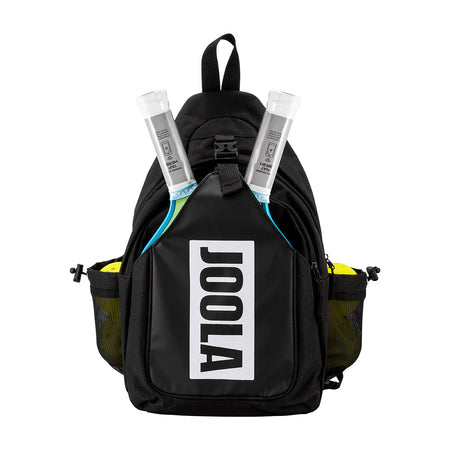 White background photo, image of the JOOLA Aurora pickleball pack. Image shows the sling bag packed with four pickleballs and two paddles.
