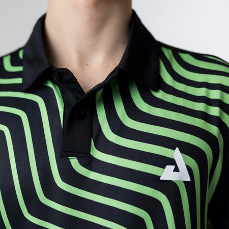 Person wearing a black and green striped shirt with a logo on a plain background