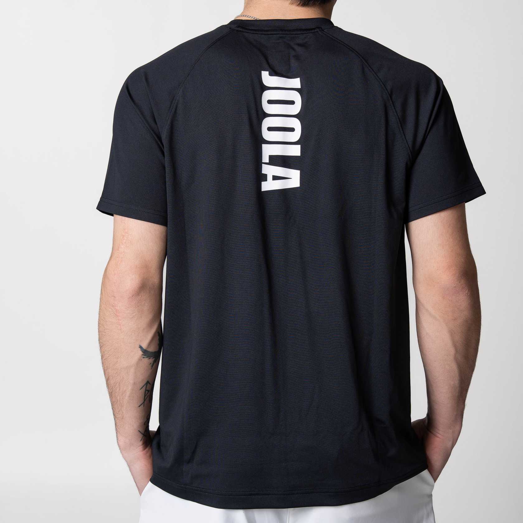 White background, image showing the back of a JOOLA Court Short Sleeve Shirt, black with white lettering.