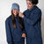 Two models wearing matching JOOLA Fleece Hoodies, Navy. Female model is wearing a JOOLA beanie.