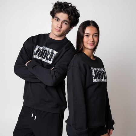 Two models posing in black JOOLA Fleece Crews.