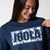Close up on the JOOLA Camo logo on a blue JOOLA Crew Fleece, Navy.