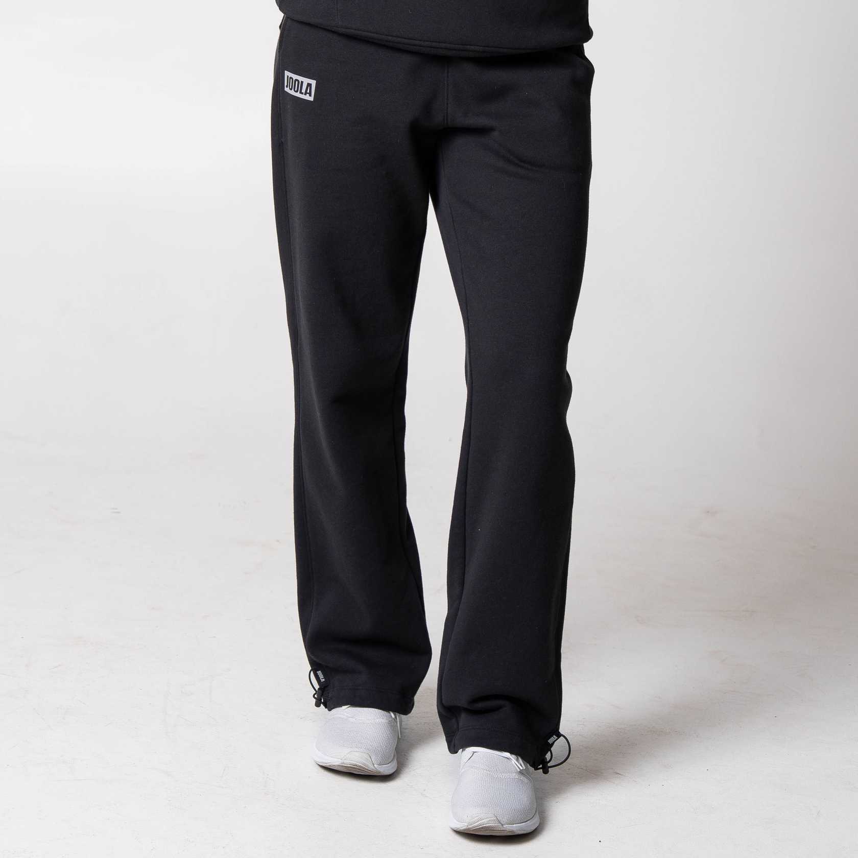 Gray background, image of a pair of JOOLA Fleece Pants, black.