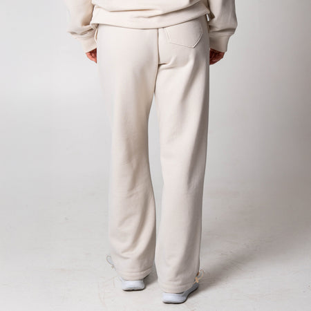Gray background, image showing the back or a pair of JOOLA Fleece pants (Sandstone).