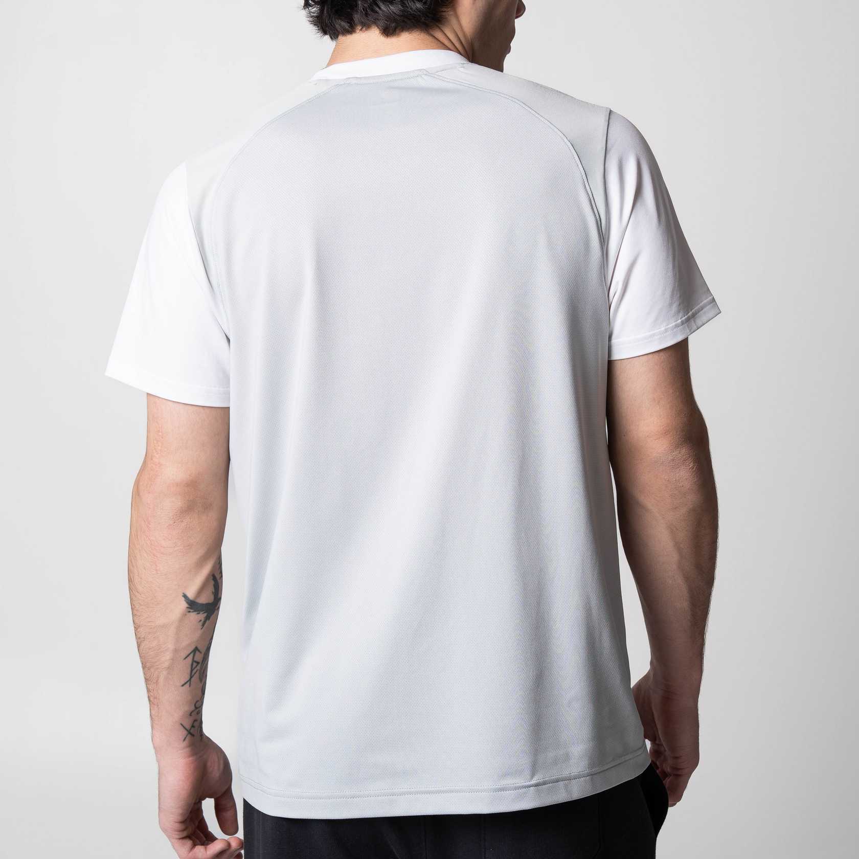 Gray background, image of the back of a JOOLA Hybrid Short Sleeve white shirt.