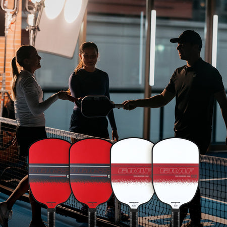 Image of JOOLA pro's Brooke Buckner, Anna Bright, and Ben Johns paddle tapping with two JOOLA Agassi and two JOOLA Graf Champion pickleball paddles in the foreground.