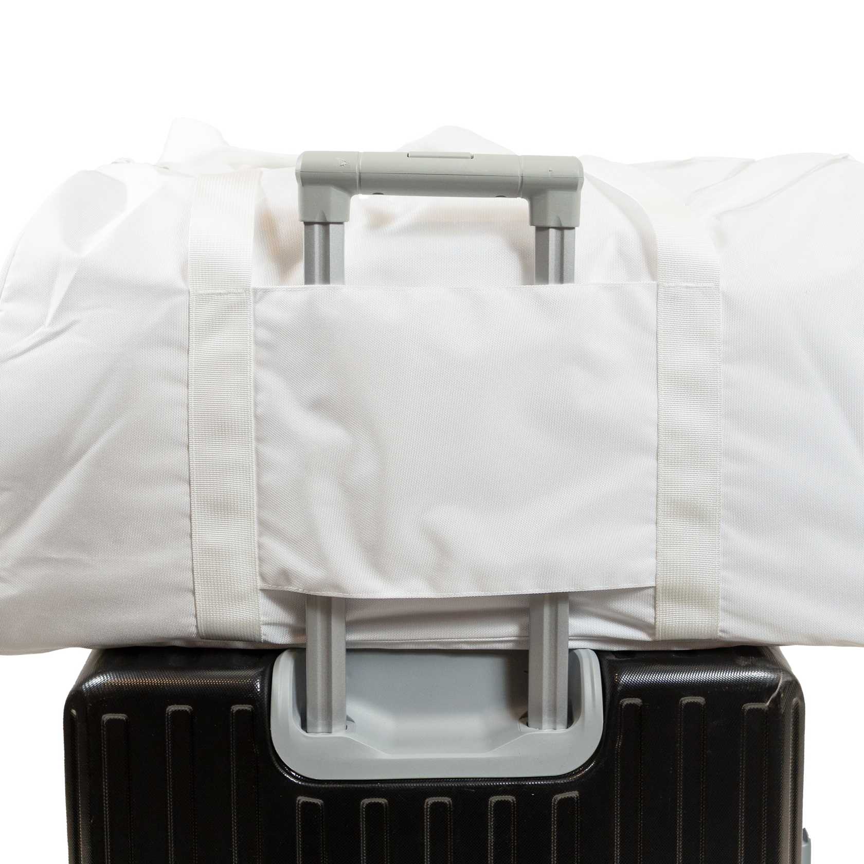 White background, image of the JOOLA Ben's Bag duffle on a rolling suitcase.