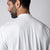 Gray background, image of the back of a JOOLA Men's Court Polo, white.