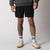 Close up image of a male models legs who is wearing a pair of JOOLA Men's Woven Short, black.