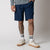 Image of a male model wearing a pair of JOOLA Men's Woven Shorts with a Nine-Inch inseam, navy.