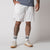 Image showing a male model wearing a pair of JOOLA Men's Woven Shorts with a Nine-inch inseam, white.