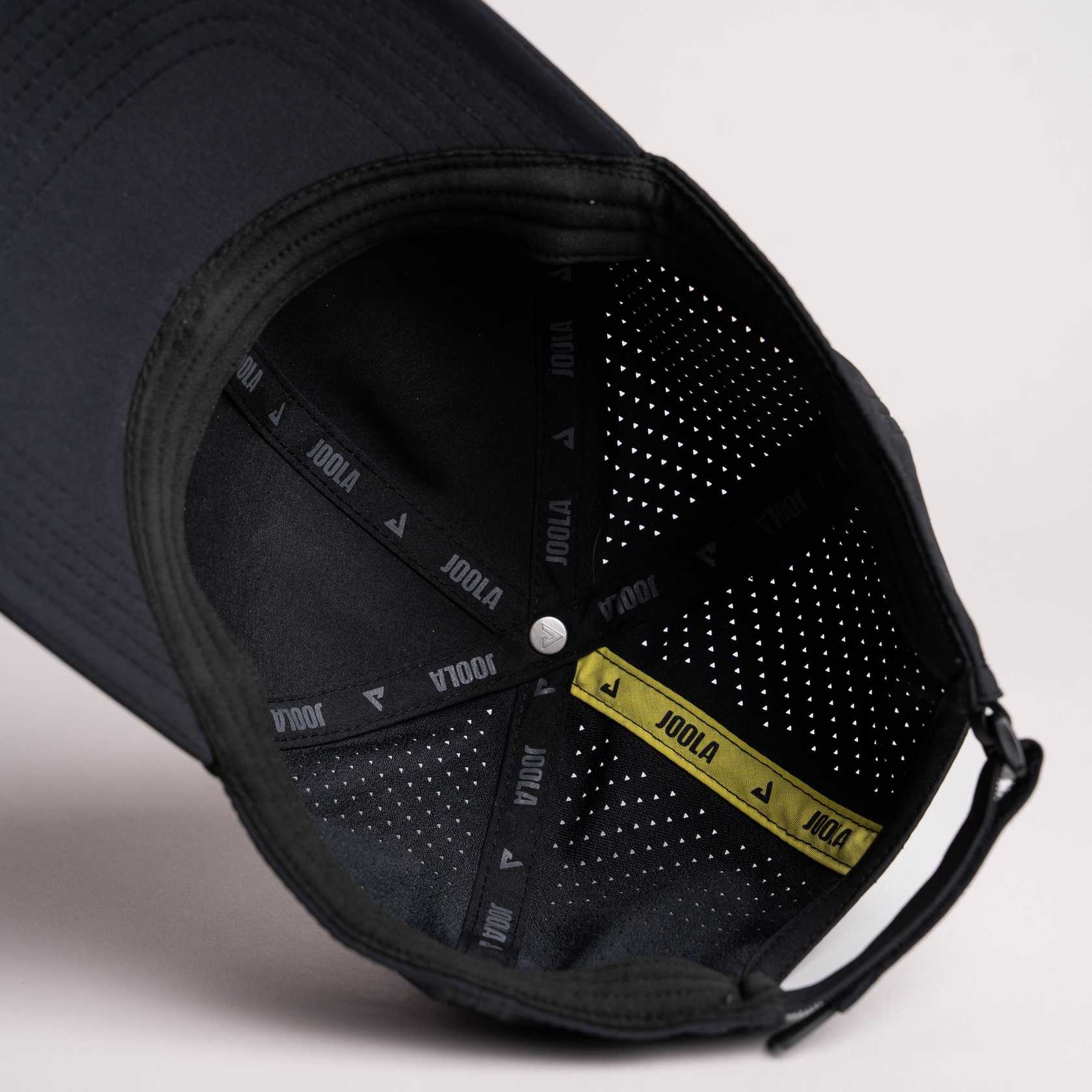 White background, product image of the inside of the JOOLA Perforated Cap, black.