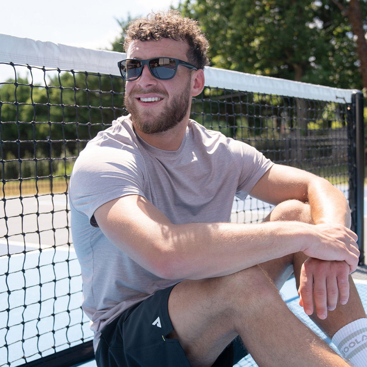 Product image showing a pair of JOOLA RJX Lite eyewear in matte black.