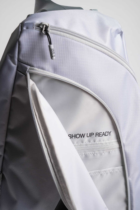 Close up on the text 'Show Up Ready' on the inside of the JOOLA Sling Bag.