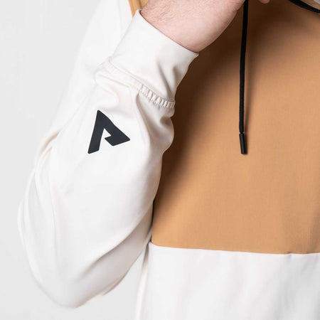 White background, close up of the JOOLA trinity logo on the sleeve of the JOOLA Half Zip.
