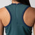 Close up image showing the detailed back zipper and JOOLA trinity logo design on the back of a JOOLA Women's Court Dress. Club Green.