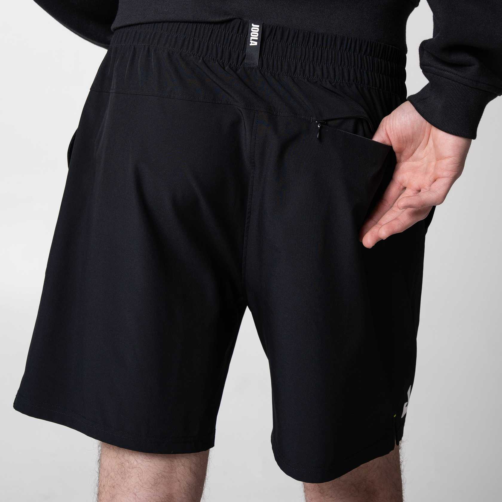 Image of the back of a pair of JOOLA Woven Shorts, black with 7-inch inseam.