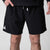 Gray background, close up image of the JOOLA Men's Woven Shorts, black, 7-inch inseam.